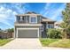 Charming two-story home with well-maintained landscaping, a two-car garage, and a welcoming front porch at 8935 Sleepy Grass Ct, Parker, CO 80134