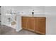Upstairs hallway showing carpet, railings and built-in cabinet at 8935 Sleepy Grass Ct, Parker, CO 80134