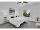 Sun-filled main bedroom with ceiling fan and lake view art at 8935 Sleepy Grass Ct, Parker, CO 80134
