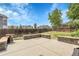 Stone patio with seat walls, view of the lawn and blue skies at 8935 Sleepy Grass Ct, Parker, CO 80134