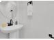 Simple powder room with pedestal sink at 8935 Sleepy Grass Ct, Parker, CO 80134