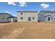A leveled backyard perfect for future landscaping and outdoor activities, adjacent to neighboring houses at 5718 Ranch St, Mead, CO 80504