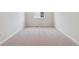 Bedroom with neutral carpet, white walls and a window for ample natural light at 5718 Ranch St, Mead, CO 80504