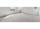 Bright bedroom with neutral carpet and windows offering scenic views at 5718 Ranch St, Mead, CO 80504