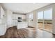 Well-lit kitchen with white cabinets, stainless steel appliances, and center island at 5718 Ranch St, Mead, CO 80504