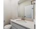 Modern powder room features a vanity with a white countertop and brushed nickel faucet at 5718 Ranch St, Mead, CO 80504