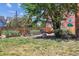 Spacious backyard with a hammock, lush lawn, a garden, and a wooden fence at 85 N Grant St # 28, Denver, CO 80203