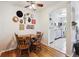 Cozy dining area with wood floors, table, and chairs adjacent to the kitchen with an arched entry at 85 N Grant St # 28, Denver, CO 80203