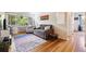 Comfortable living room boasting hardwood floors, a cozy sofa, large windows, and stylish decor at 85 N Grant St # 28, Denver, CO 80203