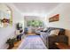 Inviting living room with hardwood floors, natural light, comfortable seating, and stylish decor at 85 N Grant St # 28, Denver, CO 80203