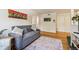 Cozy living room with hardwood floors, a comfortable gray sofa, and tasteful decor and artwork at 85 N Grant St # 28, Denver, CO 80203