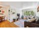 Spacious living room featuring hardwood floors, an open layout, and ample natural light at 85 N Grant St # 28, Denver, CO 80203