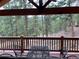 Relax on the deck, offering peaceful views of the surrounding pine forest at 9705 Canon Dr, Sedalia, CO 80135