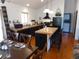 View of eat-in kitchen with island, bar seating, and adjacent dining table at 9705 Canon Dr, Sedalia, CO 80135