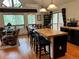 Bright living area featuring an open kitchen and dining area, with a view to the deck at 9705 Canon Dr, Sedalia, CO 80135