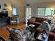 Inviting living room with hardwood flooring, comfortable seating, and access to the outdoors at 9705 Canon Dr, Sedalia, CO 80135