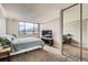 Serene bedroom with large windows offering city views, neutral carpet, and ample closet space at 1850 Folsom St # 402, Boulder, CO 80302