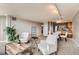 A comfortable living room featuring neutral decor and modern furnishings adjacent to dining area and kitchen at 1850 Folsom St # 402, Boulder, CO 80302