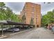A parking lot in front of an apartment building with covered parking, providing convenient and secure parking options at 1850 Folsom St # 402, Boulder, CO 80302