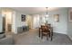 Open living and dining area with grey walls, and built-in shelving at 800 N Pearl St # 707, Denver, CO 80203