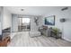 Living room showing modern decor, including a gray sofa, ottoman, and decorative artwork at 800 N Pearl St # 707, Denver, CO 80203