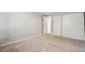Neutral carpeted bedroom with closet space and electrical outlet at 2453 S Xanadu Way # C, Aurora, CO 80014
