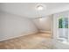 Bright, spacious bedroom with light carpet and slider to balcony at 2453 S Xanadu Way # C, Aurora, CO 80014