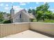 Exterior elevation featuring a private fenced patio and landscaping at 2453 S Xanadu Way # C, Aurora, CO 80014