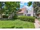 Charming home with a well-manicured lawn, mature trees, and lush landscaping at 2453 S Xanadu Way # C, Aurora, CO 80014