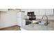 Modern kitchen features new stainless steel appliances and granite countertops at 2453 S Xanadu Way # C, Aurora, CO 80014