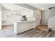 Kitchen featuring white cabinets, modern appliances, and granite countertops at 2453 S Xanadu Way # C, Aurora, CO 80014
