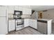 Modern kitchen featuring stainless steel appliances and granite countertops at 2453 S Xanadu Way # C, Aurora, CO 80014