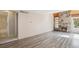 Spacious living area featuring a stone fireplace and new hardwood floors at 2453 S Xanadu Way # C, Aurora, CO 80014