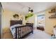 Cozy bedroom decorated with creative details and a ceiling fan at 2022 S Helena St # G, Aurora, CO 80013