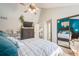 Bedroom with large mirror closet and ceiling fan at 2022 S Helena St # G, Aurora, CO 80013