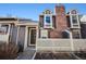Charming townhouse featuring a brick chimney and a welcoming front entrance at 2022 S Helena St # G, Aurora, CO 80013