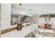 Kitchen with island sink, white countertops, and view of the staircase and living room at 2022 S Helena St # G, Aurora, CO 80013