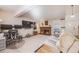 Cozy living room features a brick fireplace and is well-lit with natural light at 2022 S Helena St # G, Aurora, CO 80013
