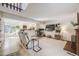 Bright living area with a cozy fireplace and an open view of the modern kitchen at 2022 S Helena St # G, Aurora, CO 80013