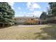 Spacious backyard with a deck and mature trees is ideal for outdoor living and entertaining at 14453 W 3Rd Ave, Golden, CO 80401