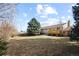 Expansive backyard with mature trees and a well-maintained lawn, offering plenty of space for outdoor activities at 14453 W 3Rd Ave, Golden, CO 80401