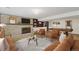 Spacious basement with a fireplace, built-in shelving, and a pool table, ideal for entertaining at 14453 W 3Rd Ave, Golden, CO 80401