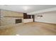 Spacious basement with a fireplace and built-in shelving at 14453 W 3Rd Ave, Golden, CO 80401