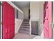 Bright foyer showcasing the front door, staircase with white railing, and tile flooring, providing a welcoming entrance at 14453 W 3Rd Ave, Golden, CO 80401