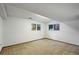 Spacious room with carpet, bright light from two windows, and neutral walls, suitable for multiple uses at 14453 W 3Rd Ave, Golden, CO 80401