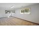 Bright and airy room with large windows providing ample natural light, carpet flooring, and fresh paint at 14453 W 3Rd Ave, Golden, CO 80401