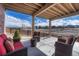 Cozy outdoor space with comfortable seating that has a view of the landscape and the community at 4883 S Sicily St, Aurora, CO 80015