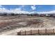 Beautiful scenery of the backyard featuring a pond, walking trail, and wooden fence at 4883 S Sicily St, Aurora, CO 80015