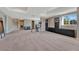 Spacious finished basement offering recessed lighting, built-in shelving, and large windows at 4883 S Sicily St, Aurora, CO 80015