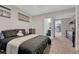 Nicely decorated bedroom with a bed, dresser, and connecting bathroom at 4883 S Sicily St, Aurora, CO 80015